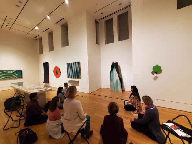 Photograph of group meditation in the Moira Dryer: Back in Business exhibition